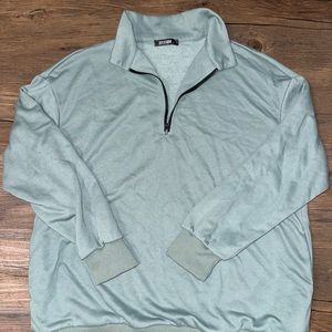 Blue/green quarter zip sweater with pockets